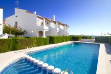 Таунхаус на Оспиталет дель Инфант - ARENAL adosado 1ª línea del mar, piscina comun